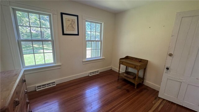 815 Beacon Hill Rd, Block Island, RI 02807 - unfurnished room with dark wood-type flooring and baseboards