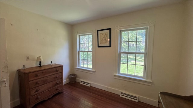 815 Beacon Hill Rd, Block Island, RI 02807 - bedroom featuring multiple windows and dark wood-style floors