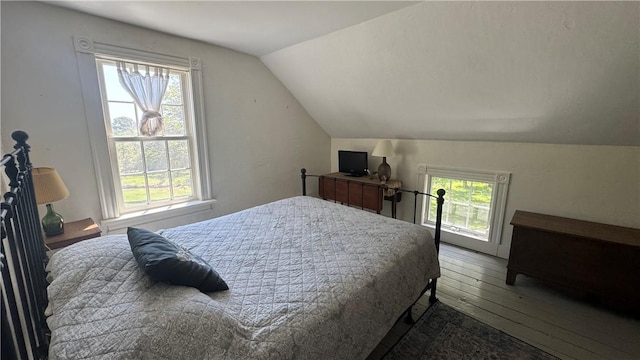 815 Beacon Hill Rd, Block Island, RI 02807 - bedroom with wood-type flooring and lofted ceiling