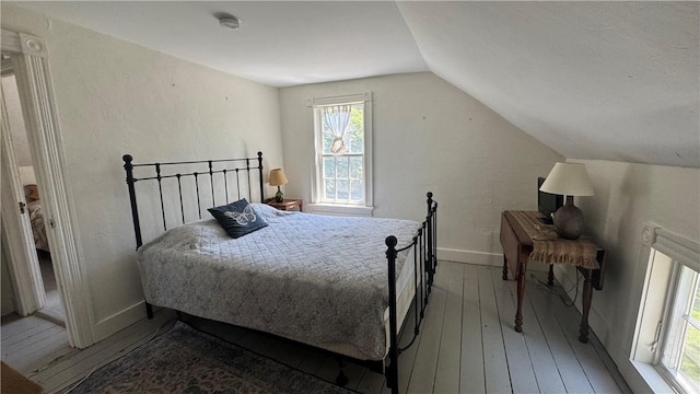 815 Beacon Hill Rd, Block Island, RI 02807 - bedroom with hardwood / wood-style flooring and lofted ceiling