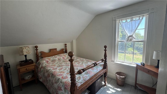 815 Beacon Hill Rd, Block Island, RI 02807 - bedroom with lofted ceiling and tile patterned floors