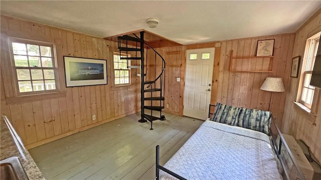 815 Beacon Hill Rd, Block Island, RI 02807 - bedroom featuring hardwood / wood-style flooring, multiple windows, and wooden walls