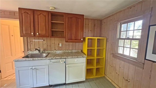 815 Beacon Hill Rd, Block Island, RI 02807 - kitchen with white dishwasher, open shelves, wood walls, and light stone countertops