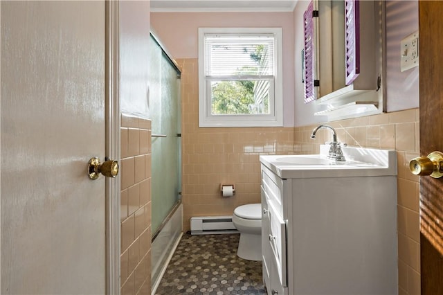 116 Balsam Rd, South Kingstown, RI 02879 - bathroom with a baseboard heating unit, vanity, tile walls, shower / bath combination with glass door, and crown molding