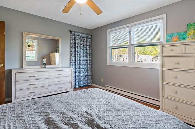 116 Balsam Rd, South Kingstown, RI 02879 - bedroom featuring a baseboard heating unit, wood finished floors, and a ceiling fan