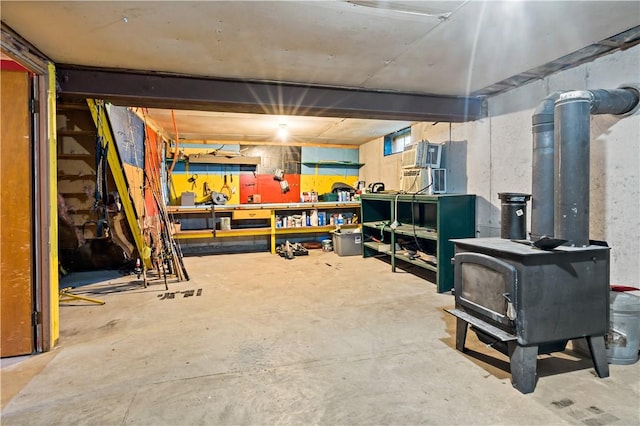 116 Balsam Rd, South Kingstown, RI 02879 - below grade area with a workshop area and a wood stove
