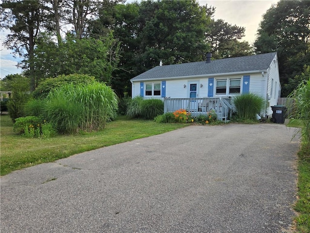 116 Balsam Rd, South Kingstown, RI 02879 - view of front of home with roof with shingles, a front yard, and asphalt driveway
