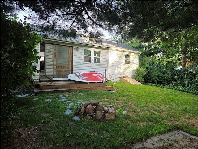 116 Balsam Rd, South Kingstown, RI 02879 - rear view of house featuring a lawn and a deck