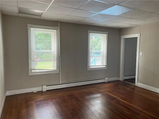 66 Railroad St, South Kingstown, RI 02879 - unfurnished room with baseboard heating, a paneled ceiling, and hardwood / wood-style floors