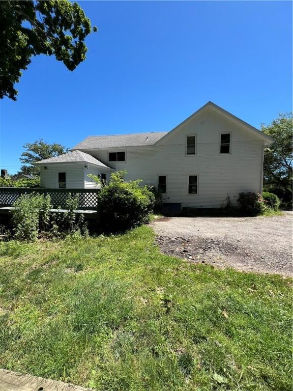 66 Railroad St, South Kingstown, RI 02879 - rear view of property with a yard