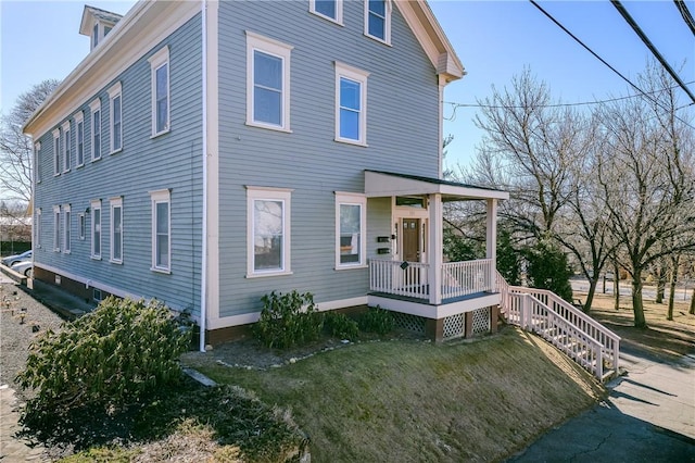 121 Doyle Ave Unit 2, Providence, RI 02906 - view of front of property with a porch and a front lawn