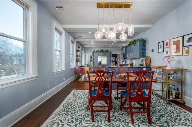 121 Doyle Ave Unit 2, Providence, RI 02906 - dining space with a chandelier and dark wood finished floors