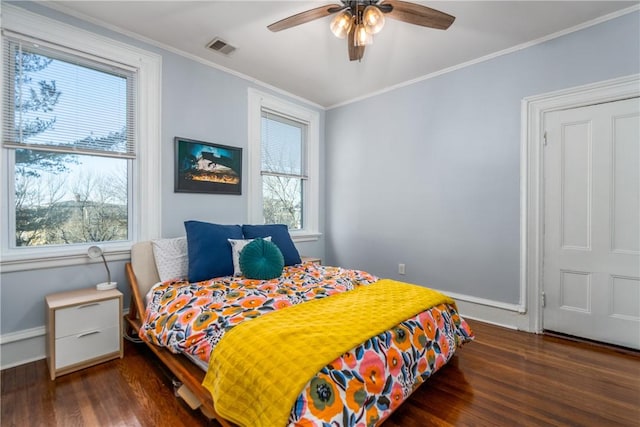 121 Doyle Ave Unit 2, Providence, RI 02906 - bedroom with multiple windows, wood finished floors, ornamental molding, and ceiling fan