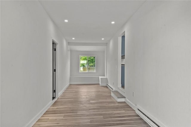 299 George Arden Ave, Warwick, RI 02886 - corridor featuring light wood-type flooring, recessed lighting, a baseboard heating unit, and a baseboard radiator