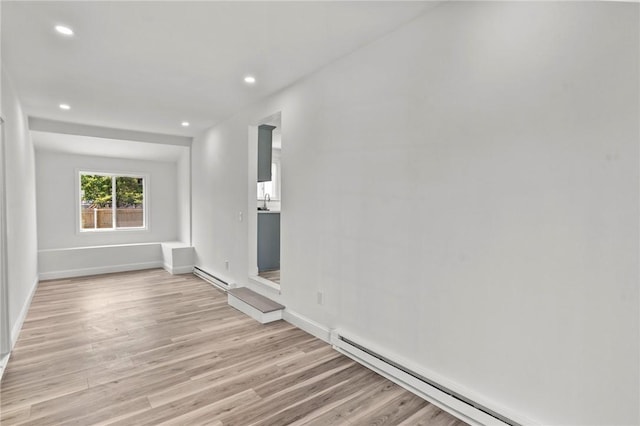 299 George Arden Ave, Warwick, RI 02886 - unfurnished living room featuring baseboard heating, light wood-style floors, and recessed lighting