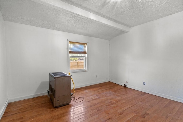 299 George Arden Ave, Warwick, RI 02886 - unfurnished room featuring wood finished floors, a textured ceiling, and beam ceiling