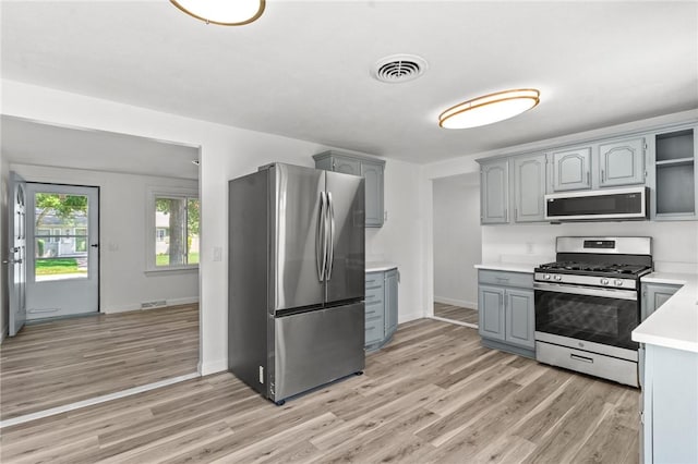 299 George Arden Ave, Warwick, RI 02886 - kitchen featuring stainless steel appliances, gray cabinets, light wood-style floors, and light countertops