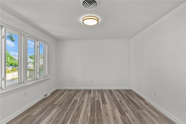 299 George Arden Ave, Warwick, RI 02886 - empty room with light wood finished floors and baseboards