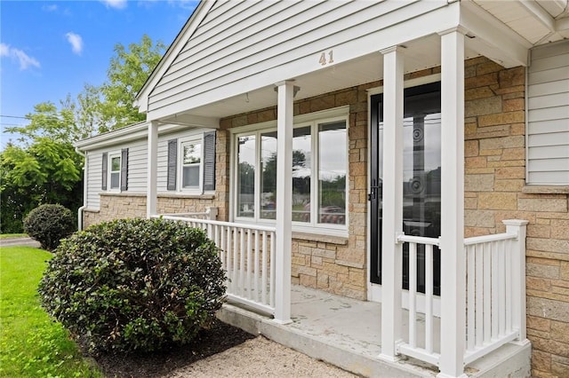 41 Valley View Dr, Cumberland, RI 02864 - view of side of property featuring covered porch and stone siding