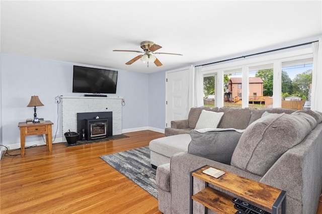 41 Valley View Dr, Cumberland, RI 02864 - living room with light wood finished floors, ceiling fan, and a wood stove