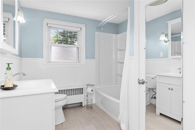 41 Valley View Dr, Cumberland, RI 02864 - full bath featuring wainscoting, radiator heating unit, vanity, shower / bath combination with curtain, and wood finished floors