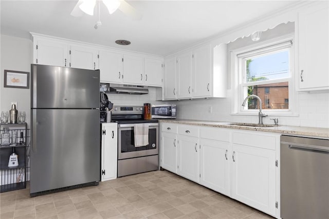 41 Valley View Dr, Cumberland, RI 02864 - kitchen with stainless steel appliances, under cabinet range hood, white cabinets, and tasteful backsplash