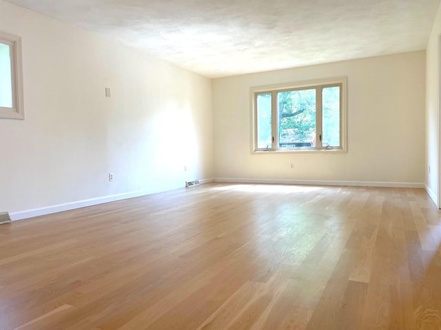 141 Sturbridge Dr, Warwick, RI 02886 - spare room with light wood finished floors and baseboards