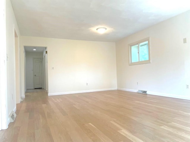 141 Sturbridge Dr, Warwick, RI 02886 - unfurnished room with light wood-type flooring and baseboards