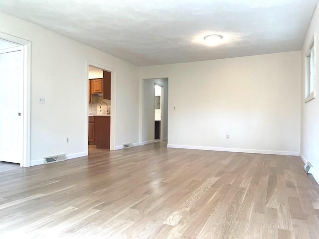 141 Sturbridge Dr, Warwick, RI 02886 - unfurnished room with light wood-type flooring and baseboards
