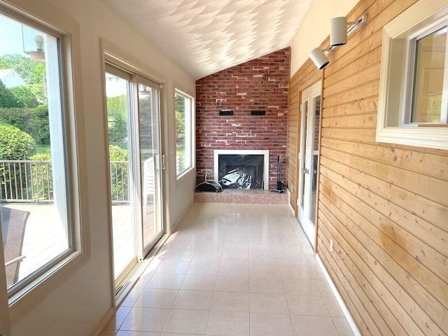 141 Sturbridge Dr, Warwick, RI 02886 - unfurnished sunroom with wooden walls, tile patterned flooring, and vaulted ceiling