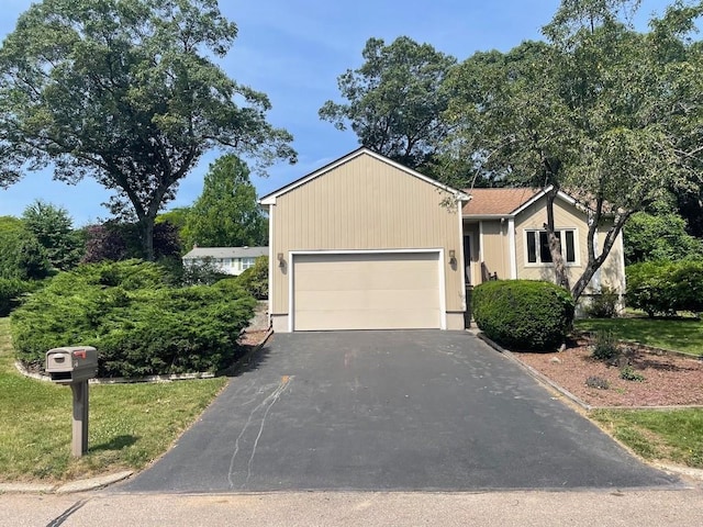 141 Sturbridge Dr, Warwick, RI 02886 - view of front of property featuring driveway and a garage
