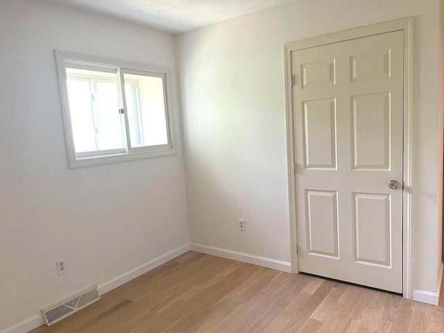 141 Sturbridge Dr, Warwick, RI 02886 - unfurnished room with light wood-style flooring and baseboards