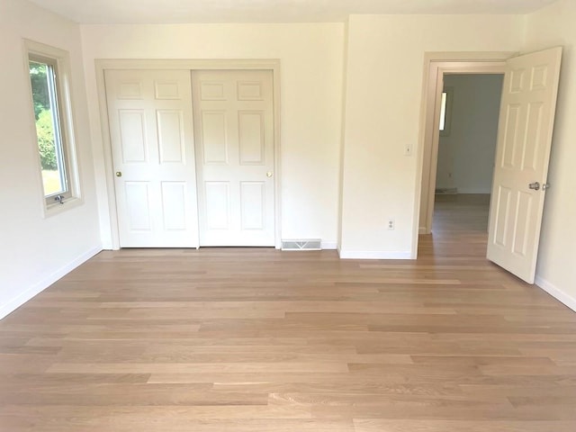 141 Sturbridge Dr, Warwick, RI 02886 - unfurnished bedroom with light wood-style floors and a closet