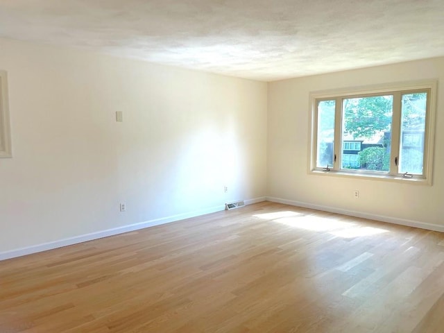141 Sturbridge Dr, Warwick, RI 02886 - unfurnished room featuring light wood-style flooring and a textured ceiling