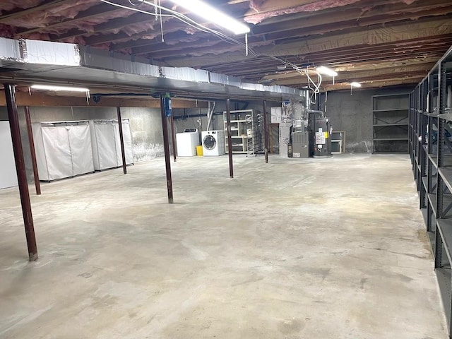 141 Sturbridge Dr, Warwick, RI 02886 - unfinished basement with washer and clothes dryer, gas water heater, and heating unit