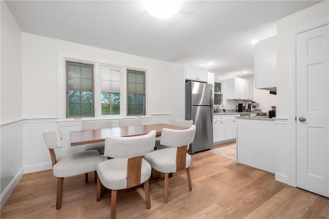 607 Knollwood Dr, Woonsocket, RI 02895 - dining area featuring light wood-style floors and healthy amount of natural light