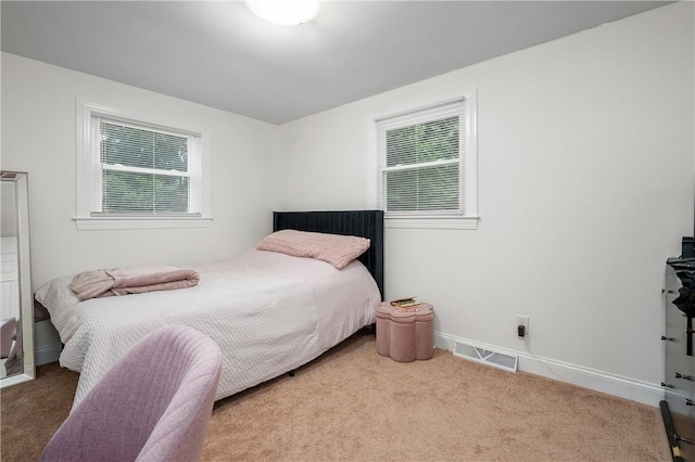 607 Knollwood Dr, Woonsocket, RI 02895 - bedroom with multiple windows and carpet floors