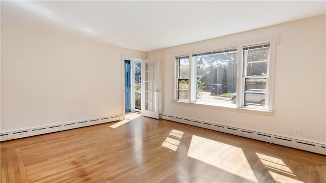 92 Glendale Dr, West Warwick, RI 02893 - unfurnished room featuring a baseboard heating unit and wood finished floors