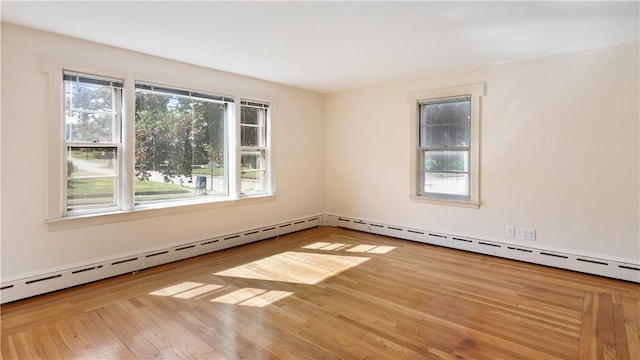 92 Glendale Dr, West Warwick, RI 02893 - spare room featuring wood finished floors and a baseboard heating unit