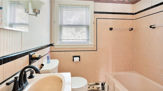 92 Glendale Dr, West Warwick, RI 02893 - bathroom featuring tile walls and a wainscoted wall