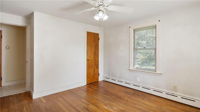 92 Glendale Dr, West Warwick, RI 02893 - spare room featuring a baseboard radiator, wood finished floors, and ceiling fan