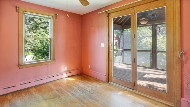 92 Glendale Dr, West Warwick, RI 02893 - unfurnished room featuring a baseboard radiator, wood finished floors, and ceiling fan