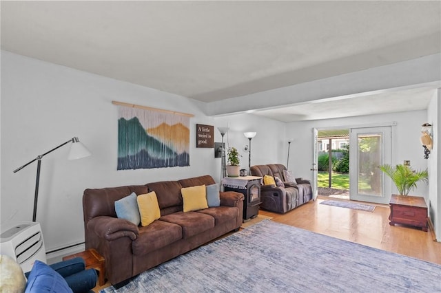 4 Clarke St, Warwick, RI 02886 - living room with wood finished floors and a baseboard radiator