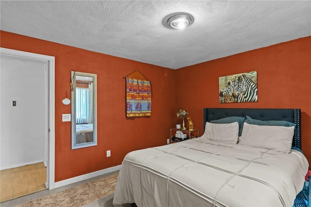 4 Clarke St, Warwick, RI 02886 - bedroom with a textured ceiling and baseboards