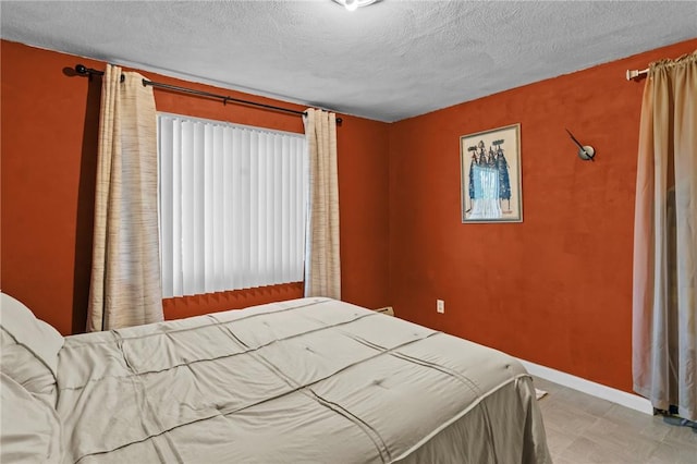 4 Clarke St, Warwick, RI 02886 - bedroom with a textured ceiling and tile patterned floors
