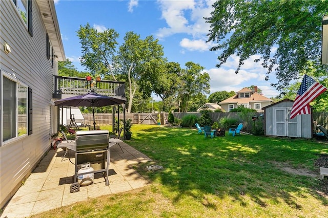4 Clarke St, Warwick, RI 02886 - fenced backyard with a shed, an outdoor fire pit, a patio area, and a deck
