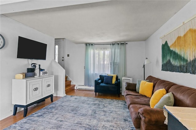 4 Clarke St, Warwick, RI 02886 - living room featuring a baseboard heating unit, wood finished floors, and stairway