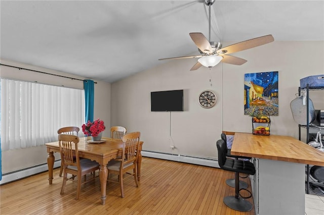 4 Clarke St, Warwick, RI 02886 - dining space with lofted ceiling, baseboard heating, a ceiling fan, and light wood-style floors