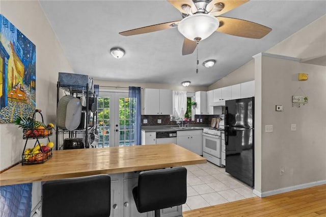 4 Clarke St, Warwick, RI 02886 - kitchen featuring white appliances, white cabinets, tasteful backsplash, ceiling fan, and french doors