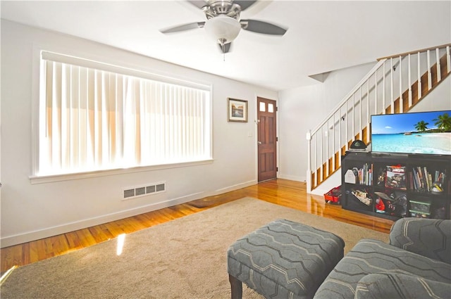 27 Observatory Rd, Warwick, RI 02888 - living area with stairs, wood finished floors, and a ceiling fan